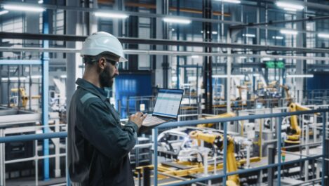 industrial employee working on laptop